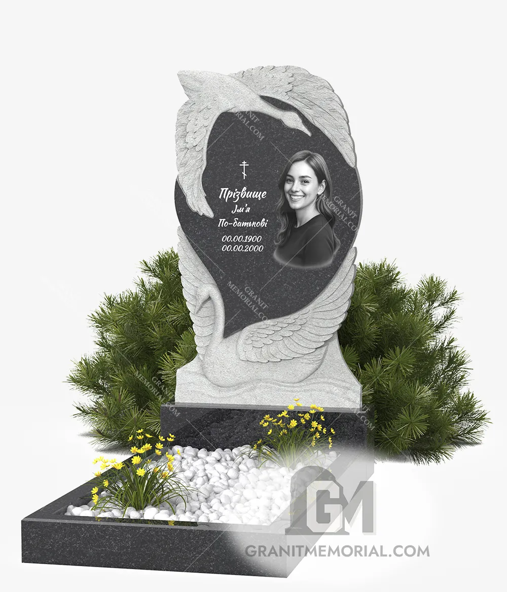 Гранитный памятник с сердцем и лебедями