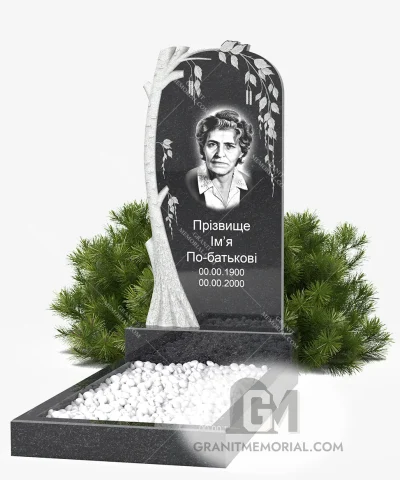 Гранитный памятник с белой березой