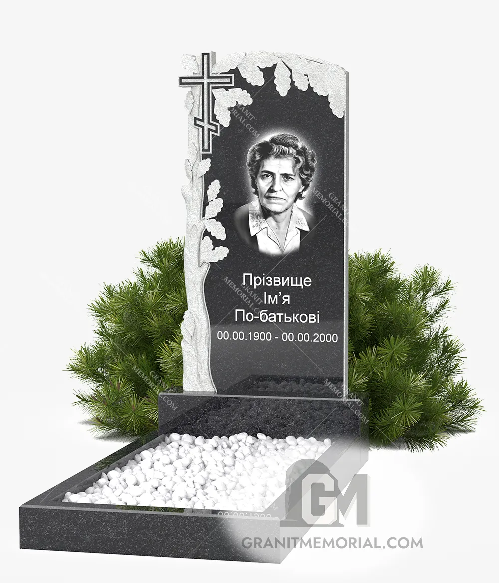 Памятник с резным крестом и деревом