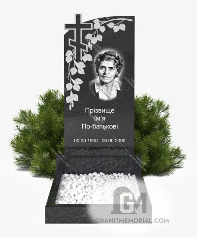 Памятник с резным крестом и ветвью